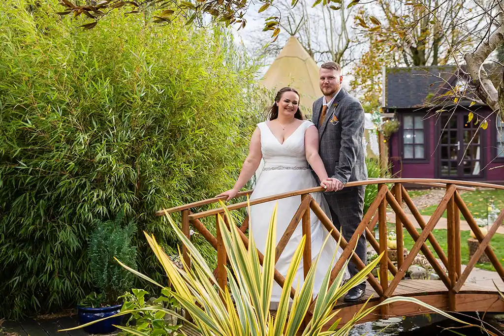 Bride & Groom on Bridge Escomb Pod Camping Tipi Durham Wedding