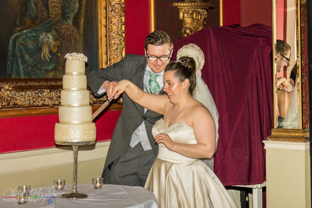 Jason&Steph Cutting Cake- Lumley Castle Wedding Photography, Durham